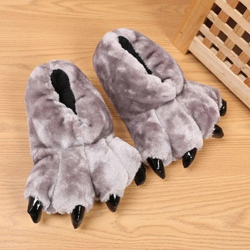 A cozy pair of Bear Paw slippers with claws on them, made with quality materials by Silly Sausage.