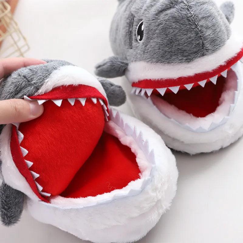 A person is enjoying the cozy comfort of their Silly Sausage shark-themed Animal Slippers.